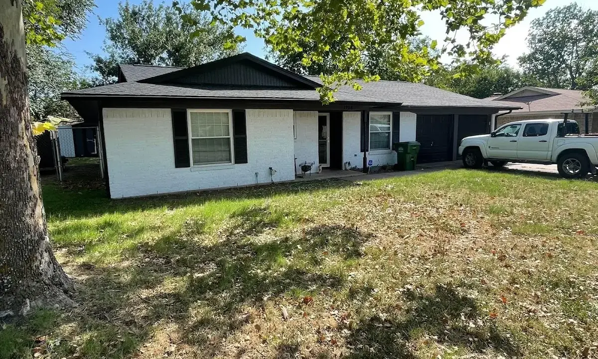 Professional roofing crew working on a residential roof in Sauk Rapids